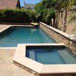 Tigers eye pebble, dark blue pool pebble finish, blue pool pebble with radiance, poured in place coping, stacked stone, plantar wall