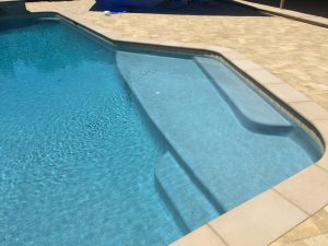 Pool Plaster, pool tile, coping, Stone Veneer, pavers, spa, baja Bench, and fire pit