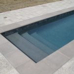 Silver Pearl Pebble on pool steps