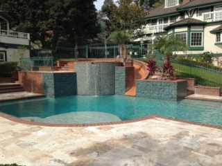 Raised Spa with slide, baja Bench Travertine deck brick coping