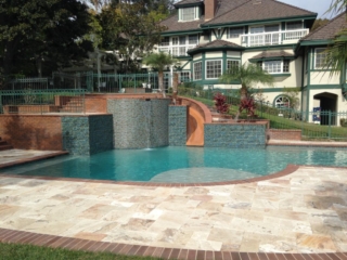Raised Spa with slide, baja Bench Travertine deck brick coping