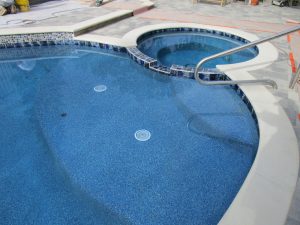pool and spa white coping pebble radiance topaz