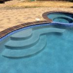 pool and spa with crystal blue radiance brick coping brown flash and orco vill pavers