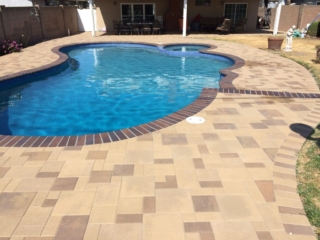pool and spa with crystal blue radiance brick coping brown flash and orco vill pavers