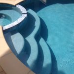 Spa steps with crystal blue and sand color coping