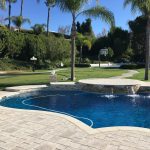 Pool with pavers and different raised bond beam heights