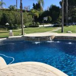 Pool with pavers and different raised bond beam heights