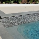 Pool and raised bond beam tiles coping