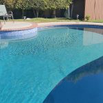 pool raised bond beam pebble finish