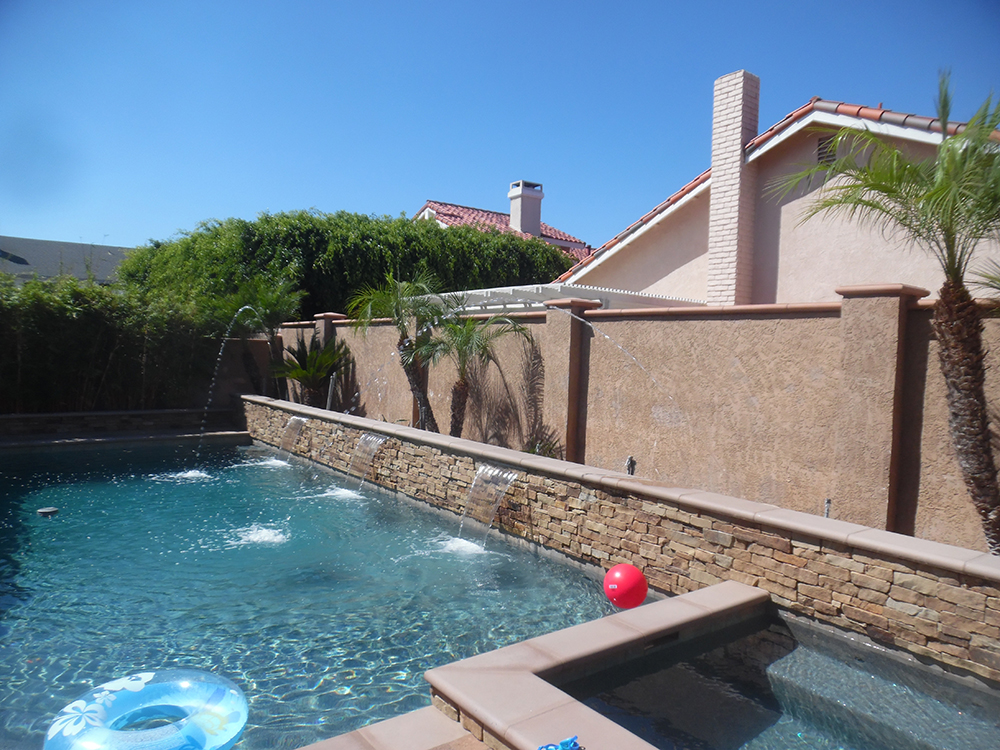 Alan Smith Pool Plastering & Remodeling | Tigers Eye Lagoon with Pebble Radiance Sandstone